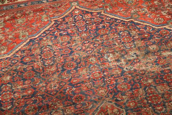 An antique Malayer carpet, dated 1905, 14ft 3in by 10ft 4in.